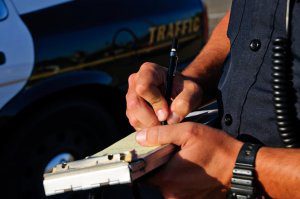 Police officer writes motorist ticket
